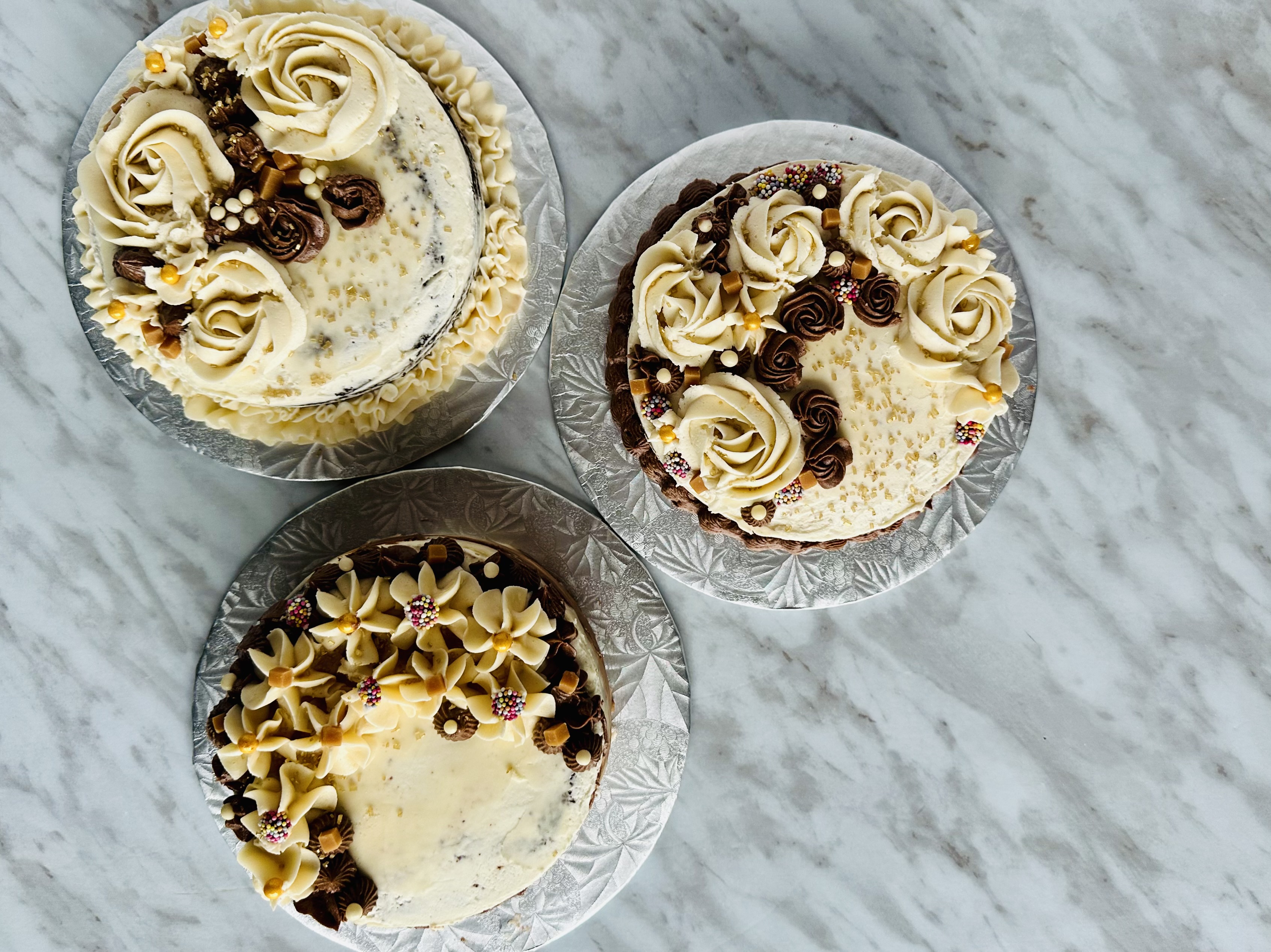 3 Chocolate Cakes decorated with Vanilla and Chocolate Buttercream